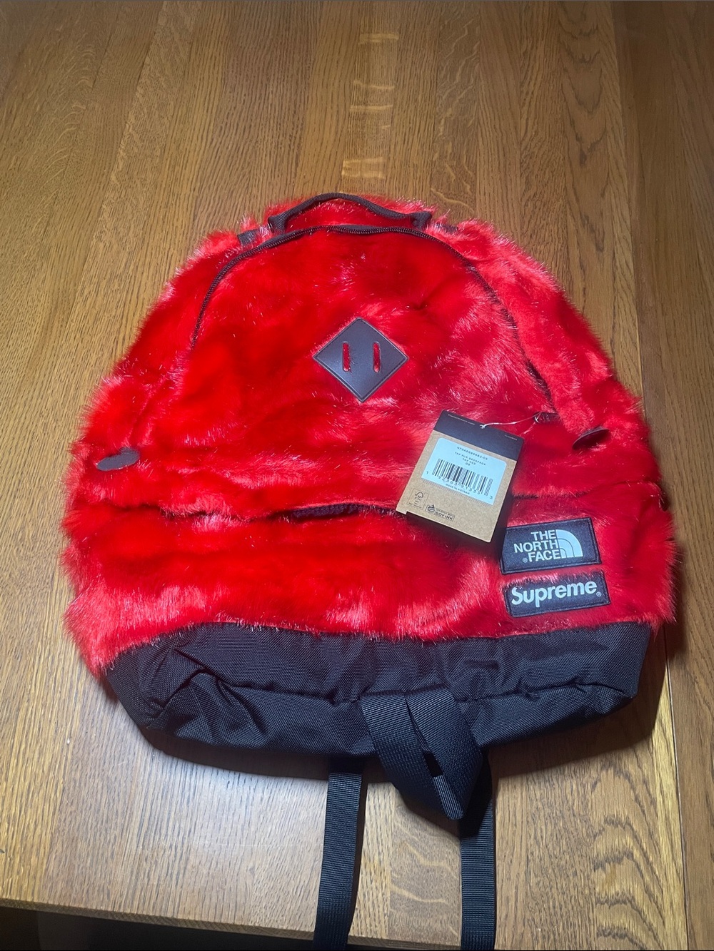 The North Face Red Faux Fur Backpack with Black Base